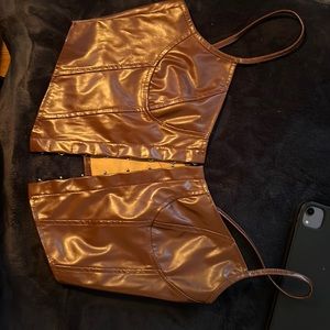 Brown polyester and spandex belly shirt with hook and eye closers